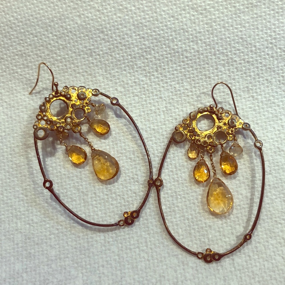 Alexis Bittar earrings with gold crystals.